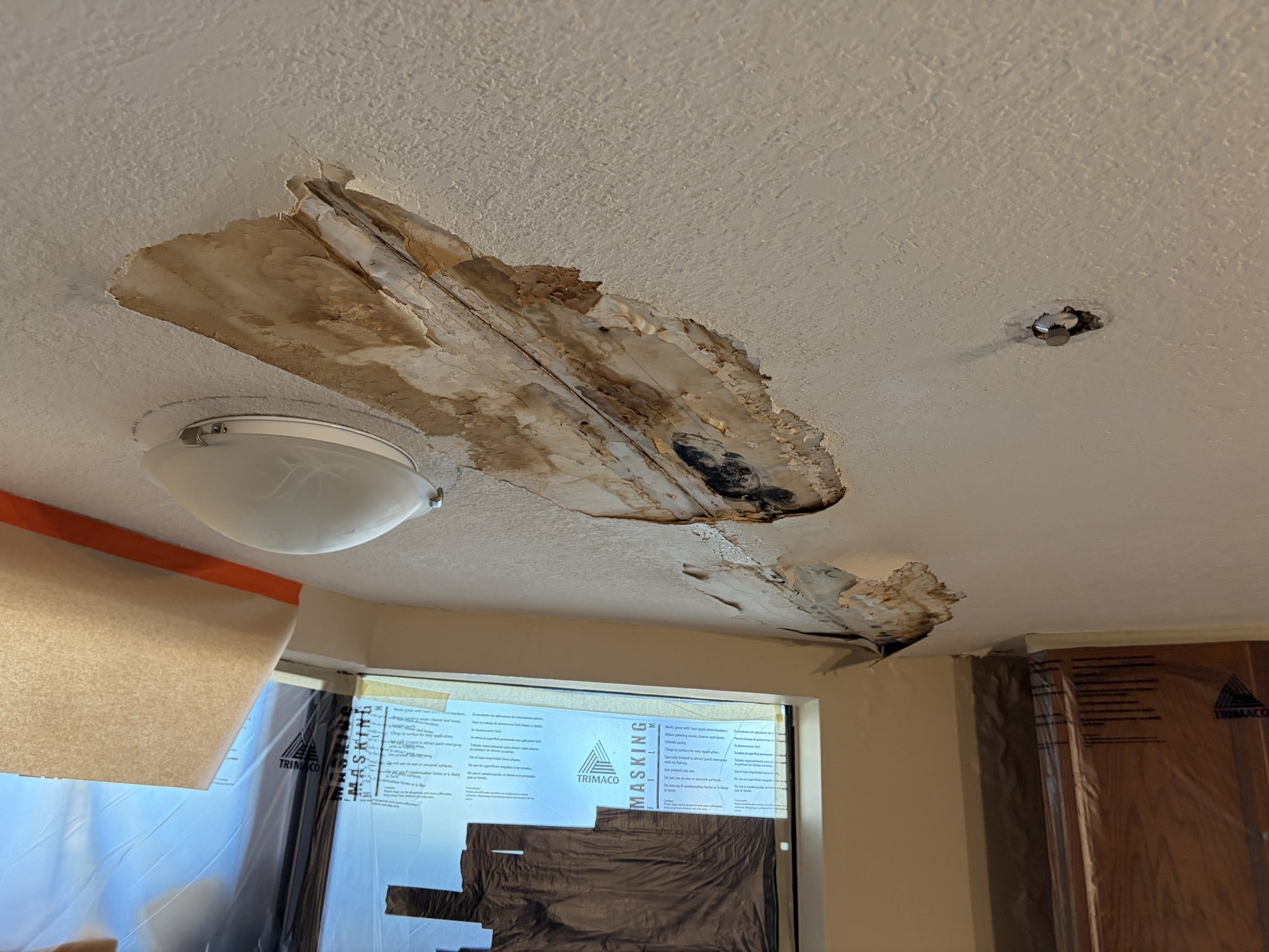 Ceiling water damage before repair